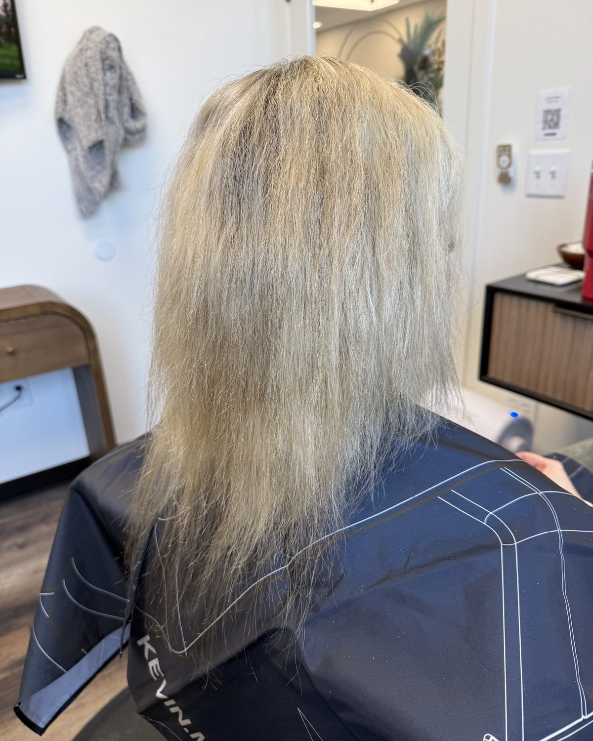 Before: fine blonde hair with thin, over-processed ends, photographed in the salon chair prior to extensions